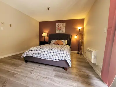 a bedroom with a bed with a pillow on it at Beverly Hills Suite in Los Angeles