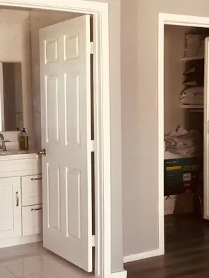 a white door in a kitchen with a closet at Noah Unit - B in Hawthorne