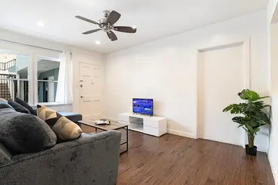 a living room with a couch and a ceiling fan at Ground-Floor 1-Bedroom by Beverly Hills Steps from Restaurants, Cafes and Shopping in Los Angeles