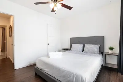 a bedroom with a bed with a ceiling fan at Ground-Floor 1-Bedroom by Beverly Hills Steps from Restaurants, Cafes and Shopping in Los Angeles