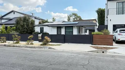 a white car parked in front of a house at Modern Studio Stylish &Cozy Right Unit in Los Angeles