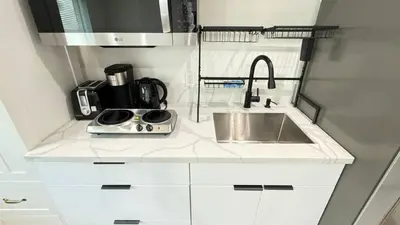 a small kitchen with a sink and a microwave at Modern Studio Stylish &Cozy Ieft Unit in Los Angeles