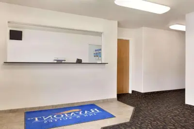 an office room with a large mirror on the wall at Travelodge by Wyndham Yermo in Yermo