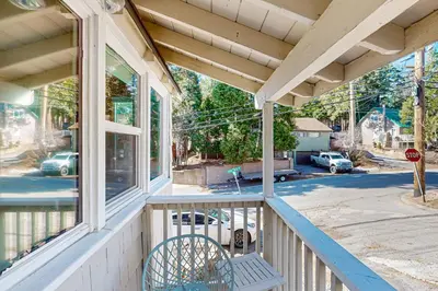 a porch of a house with a stop sign at Relaxing Retreat with Deck, 1 Mi to Lake Arrowhead! in Cedar Glen