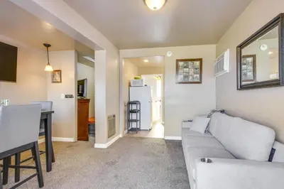 a living room with a couch and a table at Lake and Mountain Views Cozy California Stay in Mountain Mesa
