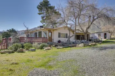 a house with a tree and a yard at 6 Mi to Lake Isabella Mountain Mesa Getaway in Mountain Mesa