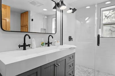 a bathroom with a sink and a shower at Bear Creek Haven -Nestled between the Village & Lake! in Big Bear Lake
