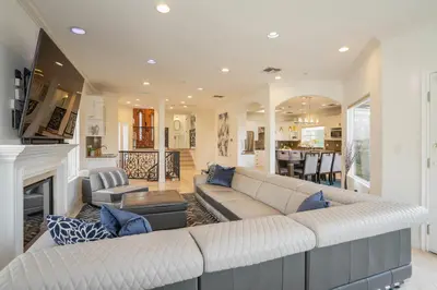 a living room with a couch and a fireplace at Luxury Modern w/ Great LA Views in Woodland Hills