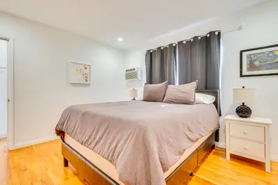 a bedroom with a bed and a window at 1 Mi to Dtwn Melrose Cozy Condo with Patio in Los Angeles