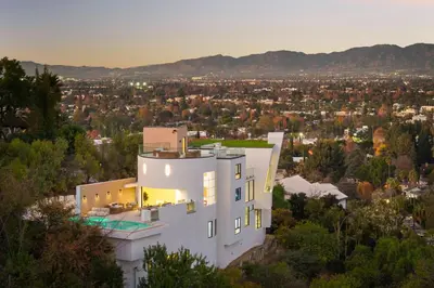 a white house with a view of a city at Woodhill Canyon in Los Angeles