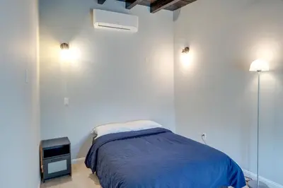 a bedroom with a bed with a blue blanket at 6 Mi to Hiking Apartment in Frazier Park in Frazier Park