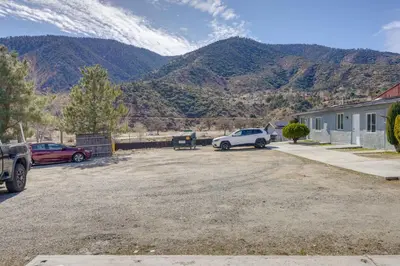 a car parked in a parking lot with mountains in the background at 6 Mi to Hiking Apartment in Frazier Park in Frazier Park