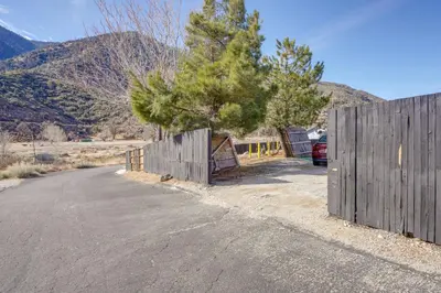 a wooden fence on the side of a road at 6 Mi to Hiking Apartment in Frazier Park in Frazier Park