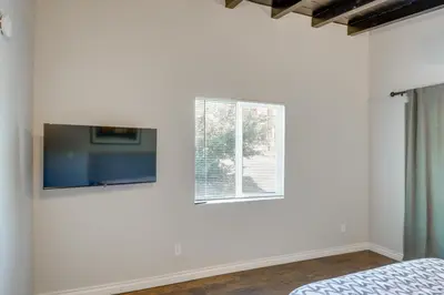 a bedroom with a tv and a window at Hike and Explore Studio Stay in Frazier Park in Frazier Park