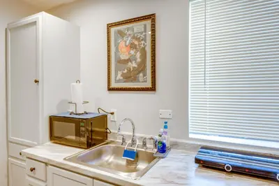 a kitchen counter with a sink and a microwave at Hike and Explore Studio Stay in Frazier Park in Frazier Park