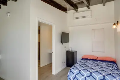 a bedroom with a bed and a television in it at Mountain Views Minimalist California Studio in Frazier Park