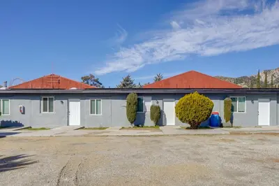 a white building with a red roof at Mountain Views Minimalist California Studio in Frazier Park