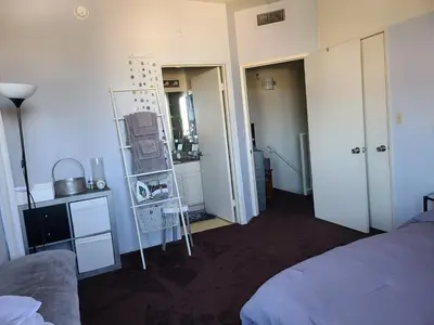 a bedroom with a bed and a room with a mirror at Guest Room in Sherman Oaks with private bathroom and balcony in Sherman Oaks
