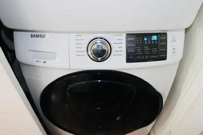 a white washing machine with a control panel at Los Angeles Blue Nest in Monterey Park
