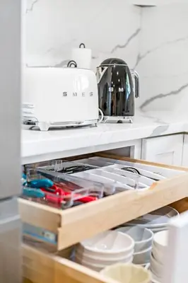 a kitchen drawer filled with dishes and a toaster at Remodeled House Near Disneyland in Fullerton