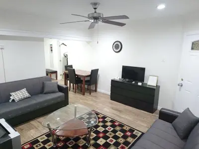 a living room with a couch and a table at Vacation Unit is Available for Business and Family Trip in Long Beach