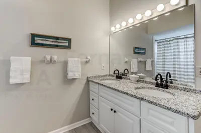 a white bathroom with a sink and a mirror at Particle Ocean View 2505B W 5th St in Los Angeles