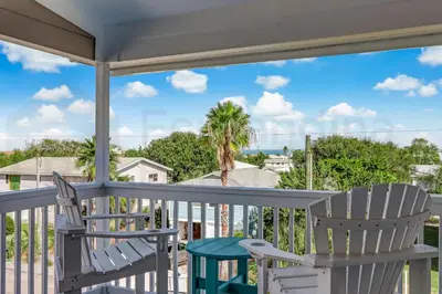 two chairs on a porch with a view of the ocean at Particle Ocean View 2505B W 5th St in Los Angeles