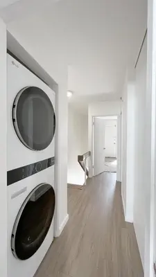 a living room with a microwave on a wall at Seaside Escape Steps from Santa Monica Beach in Los Angeles
