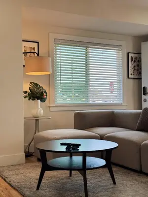 a living room with a couch and a table at Cozy private room B in S Central LA in Los Angeles