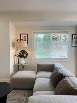 a living room with a couch and a window at Cozy Private Room C in S Central LA in Los Angeles