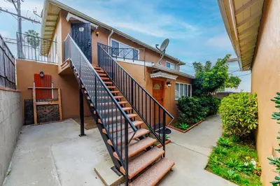 a house with a staircase in front of it at Spacious Single Apt D In Santa Monica in Los Angeles