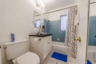 a bathroom with a toilet and a sink and a shower at Spacious Single Apt D In Santa Monica in Los Angeles