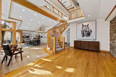 an open living room with a staircase and a dining room at A California Country Experience - Tehachapi in Tehachapi