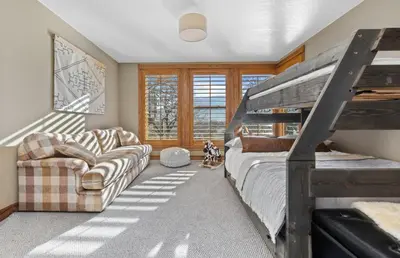 a bedroom with a bunk bed and a couch at A California Country Experience - Tehachapi in Tehachapi