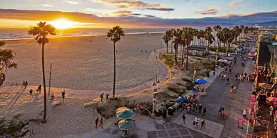 a view of a beach with palm trees and the ocean at Walk to Santa Monica Beach & Pier I Free Parking! in Los Angeles