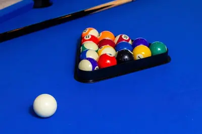 a tray of billiard balls on a pool table at Off Grid Mountaintop Paradise Pool Spa and Games in San Bernardino