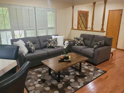 a living room with a couch and a coffee table at Extremely Chill 3 Bedroom Home in Long Beach