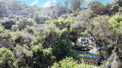 an aerial view of a house in the middle of a forest at Topanga Canyon Oasis by Colby & Conrad in Topanga