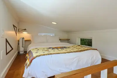 a bedroom with a large bed and a window at Topanga Canyon Oasis by Colby & Conrad in Topanga