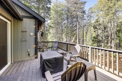 a deck with two chairs and a table on it at Swim, Hike, Ski and Unwind Lake Arrowhead Retreat! in Lake Arrowhead