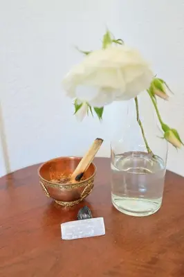 a flower in a vase and a bowl on a table at The Topanga Bungalow by Colby & Conrad in Topanga