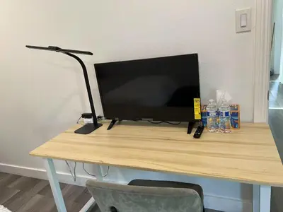 a desk with a computer monitor on top of it at \u4fbf\u6377\u5b9c\u5c45\u7684\u72ec\u7acb\u623f\u5b50 in Baldwin Park