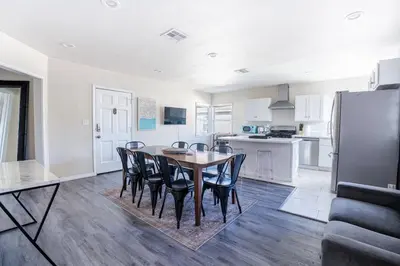 a kitchen and dining room with a table and chairs at Comfy Home Near Sofi Stadium in Los Angeles