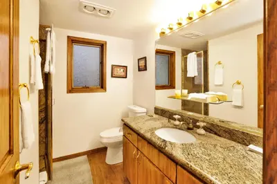 a bathroom with a sink and a toilet at The Birdhouse at Big Bear Lake- Lakeview Family Retreat in Big Bear Lake