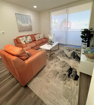 a living room with a couch and a table at Beautiful 2bd 2bth apartment in Santa Monica in Los Angeles