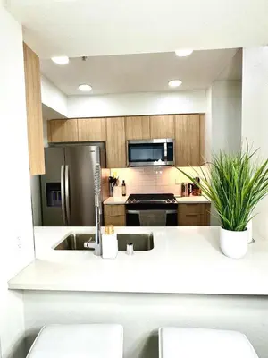 a kitchen with a sink and a refrigerator at Beautiful 2bd 2bth apartment in Santa Monica in Los Angeles