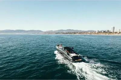 a boat traveling across a large body of water at Riva Virtus 65 Yacht Trip w Captain Overnight Stay 2812 in Los Angeles