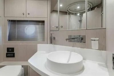a white bathroom with a sink and a toilet at Riva Virtus 65 Yacht Trip w Captain Overnight Stay 2812 in Los Angeles