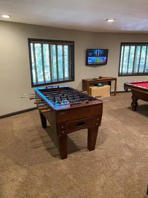 a game room with a foosball table and a pool table at Cozy Escape- Walking Distance to Village! in Lake Arrowhead