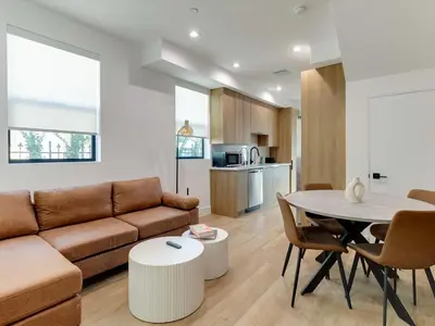 a living room with a couch and a table at Modern Luxe Retreat Six-Bedroom in Los Angeles